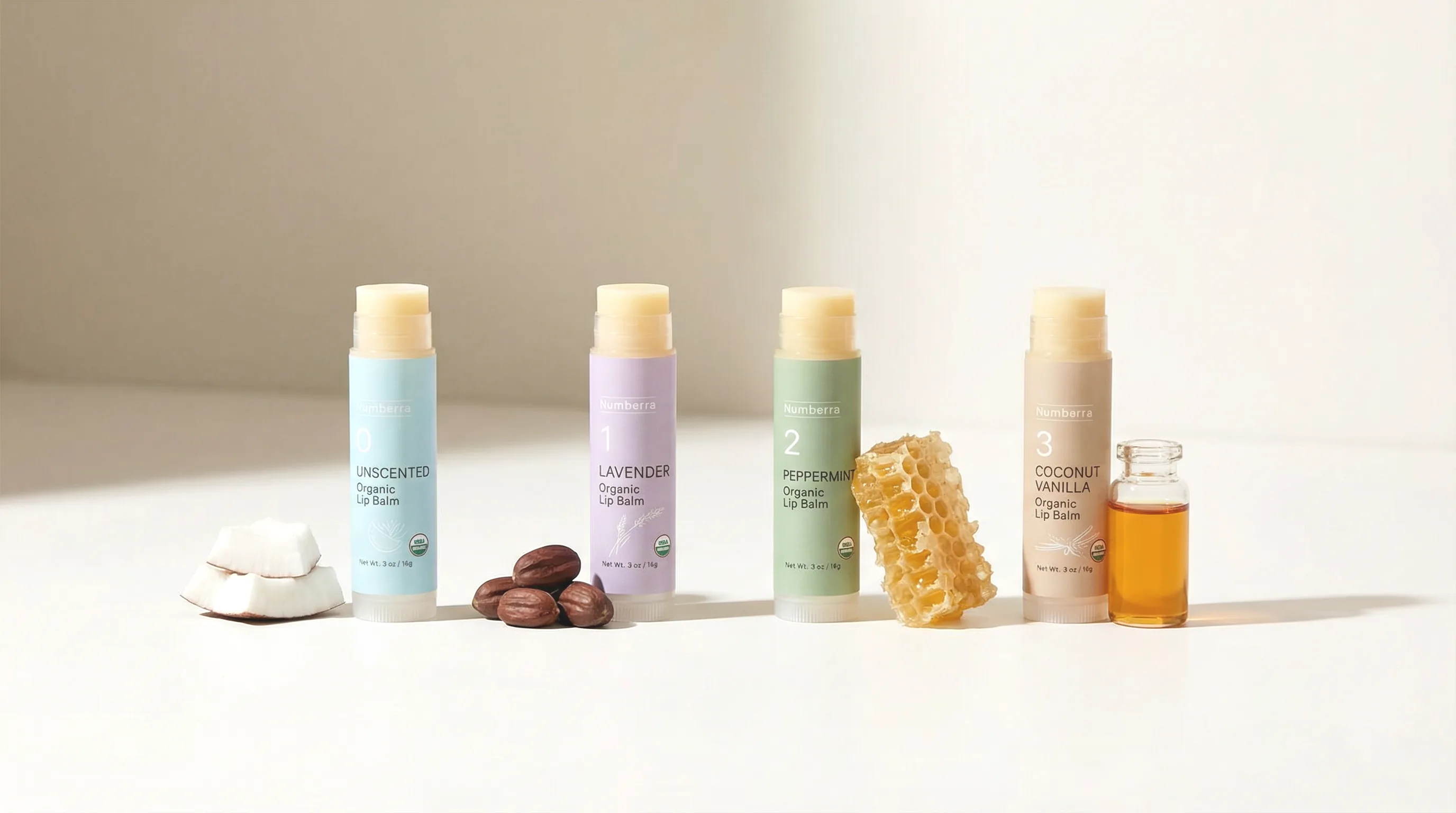 Numbrrrz organic lip balm lineup — Unscented, Lavender, Peppermint, and Coconut Vanilla with natural ingredients